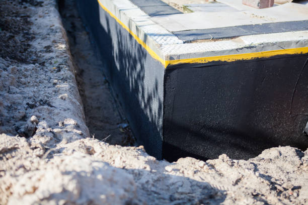 Professional Emergency Waterproofing technician working in Port Jefferson Station, NY